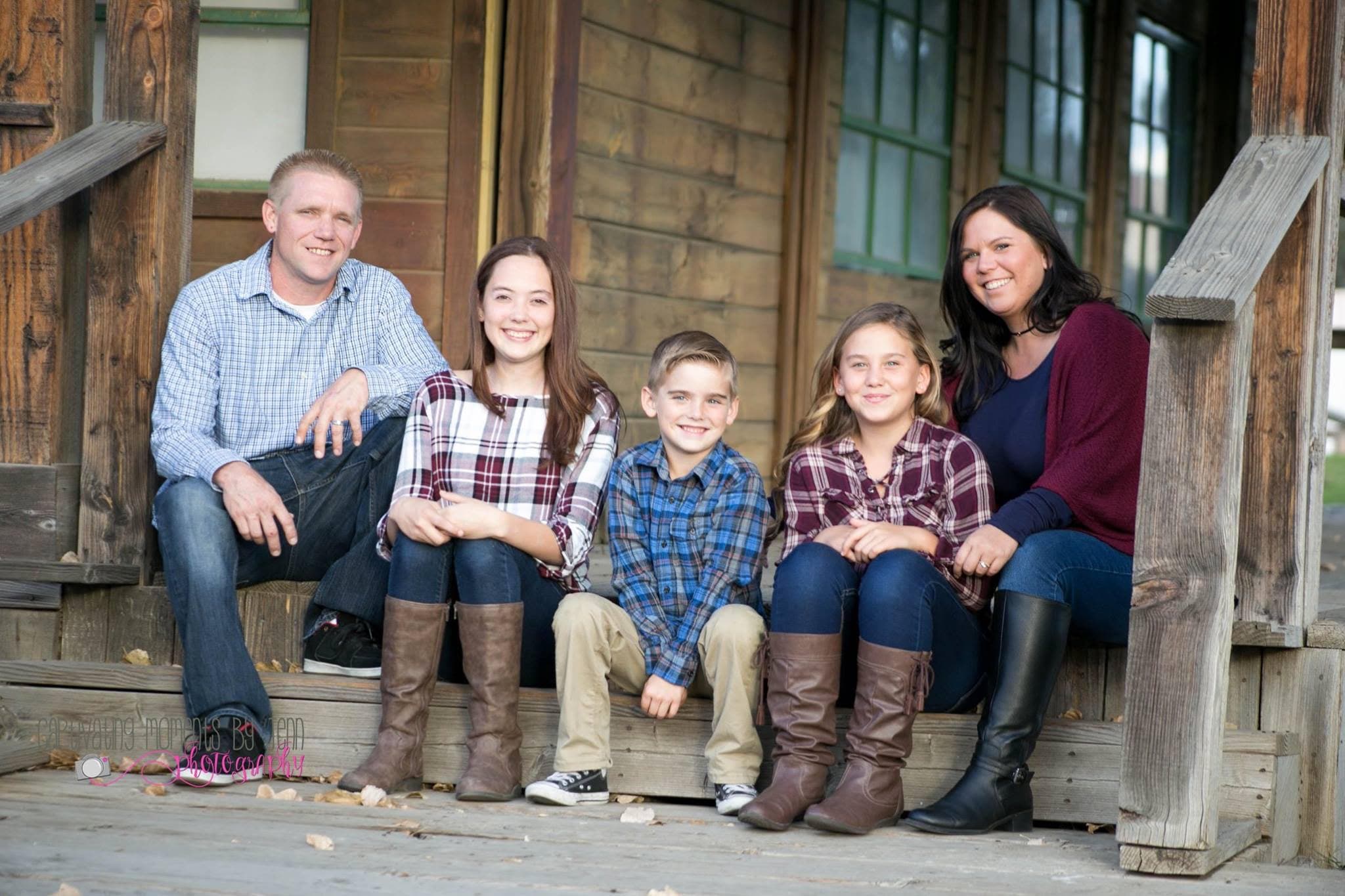 Mike Dickinson with his wife and three children on a wooden porch in Sun City